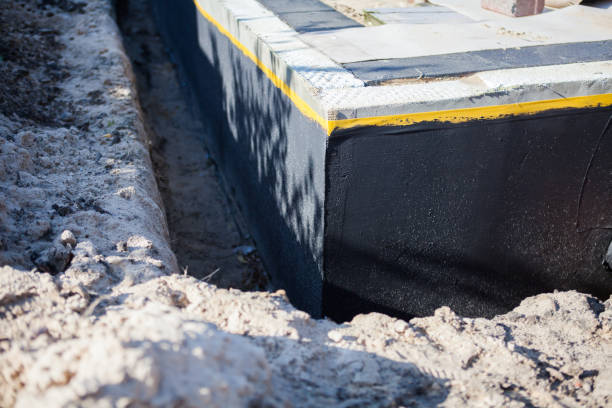 Professional Basement Waterproofing technician working in Otterbein, IN